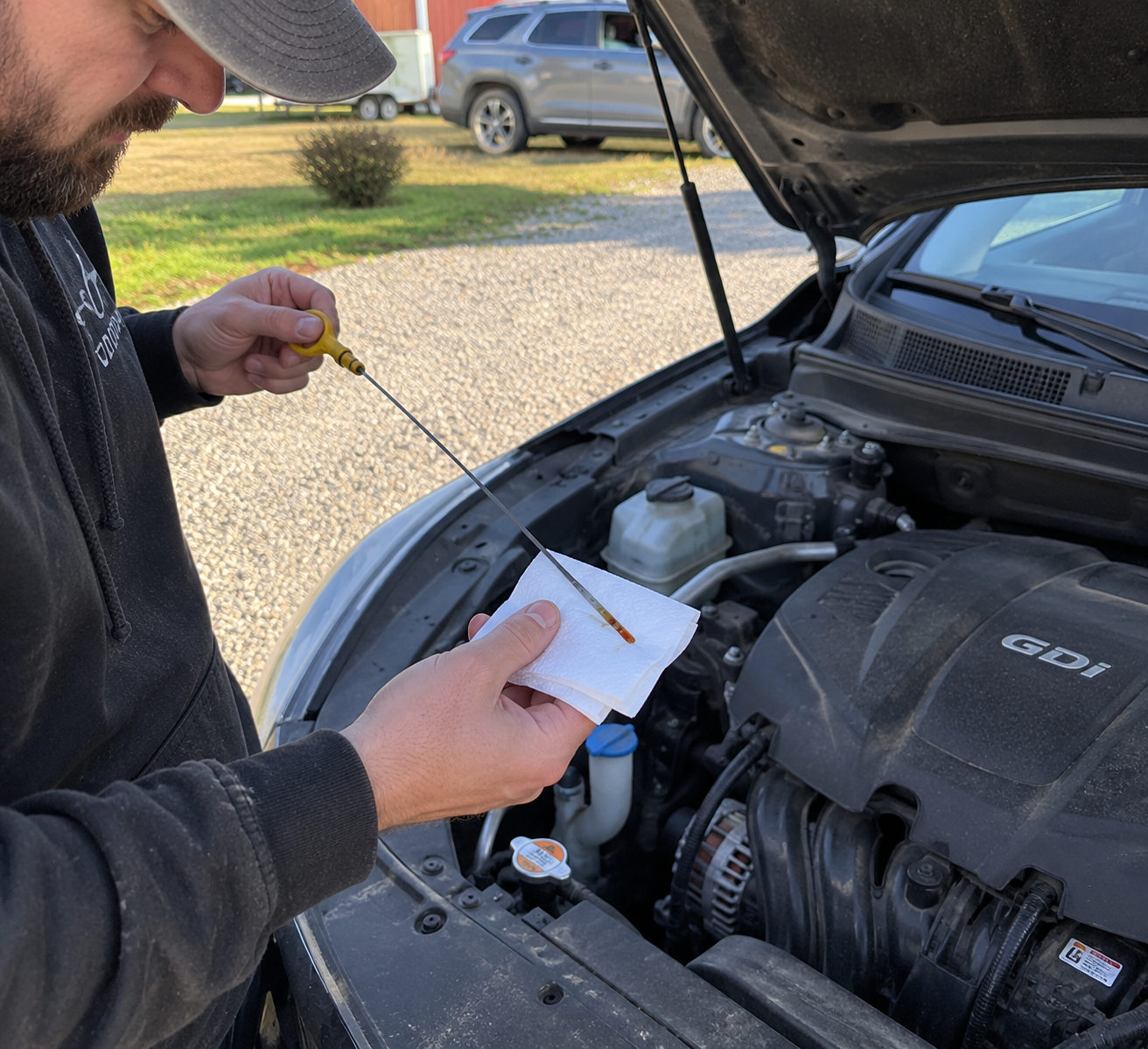 Checking my oil withy car oil dipstick